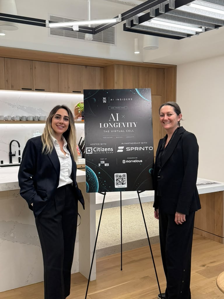 Guests at the AI × Longevity welcome sign